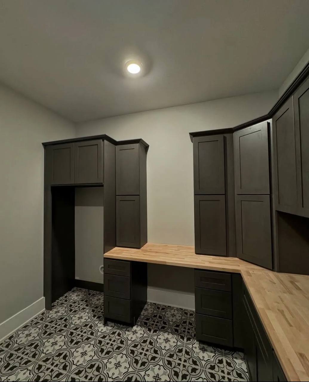 Cabinet layout and countertop details from the same room.